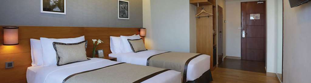 Hotel Golden Tulip Essential Denpasar Zimmer foto